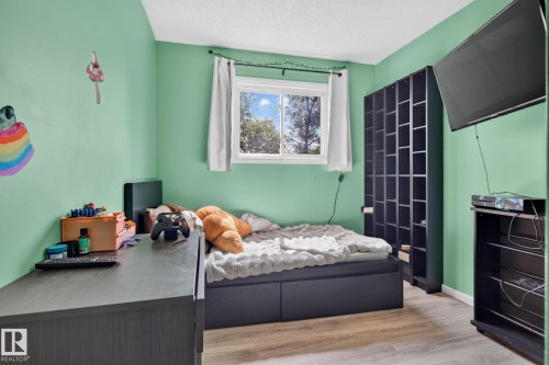 Window with white trim - 8031 27 Avenue Nw, Edmonton, AB - Indoor Photo Showing Bedroom
