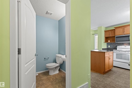 Powder room with tiled flooring - 9118 Scott Crescent Nw, Edmonton, AB - Indoor