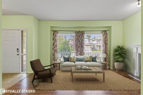Recessed bay windows provide natural light to the living space, featuring wood-finish flooring and a white decorative fireplace - 9118 Scott Crescent Nw, Edmonton, AB - Indoor Photo Showing Living Room