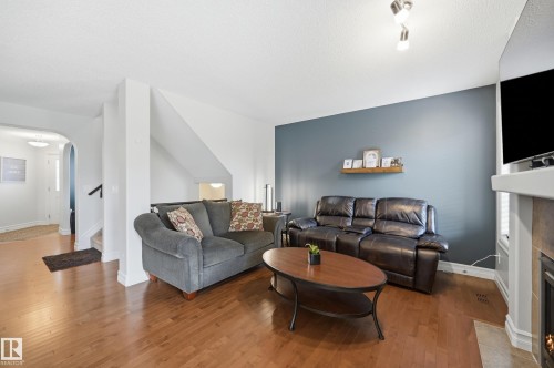 49 Navajo Ln, Fort Saskatchewan, AB - Indoor Photo Showing Living Room With Fireplace