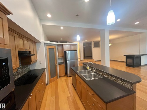 #212 10009 102 Av Nw, Edmonton, AB - Indoor Photo Showing Kitchen With Stainless Steel Kitchen With Double Sink With Upgraded Kitchen