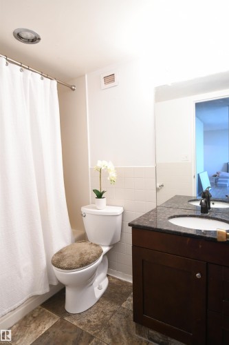 The well appointed bathroom is set away from the living room, and is conveniently only steps from the bedroom - #1305 13910 Stony Plain Rd Nw, Edmonton, AB - Indoor Photo Showing Bathroom