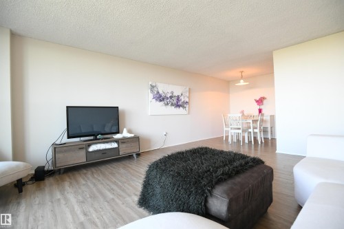 The natural light here, coupled with the view of the city, are intoxicating - #1305 13910 Stony Plain Rd Nw, Edmonton, AB - Indoor Photo Showing Living Room