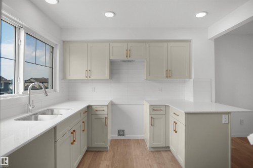 #11 531 Merlin Landing Ld Nw, Edmonton, AB - Indoor Photo Showing Kitchen With Double Sink