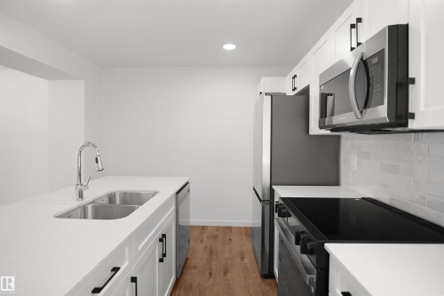 7060 Rosenthal Drive Nw, Edmonton, AB - Indoor Photo Showing Kitchen With Double Sink