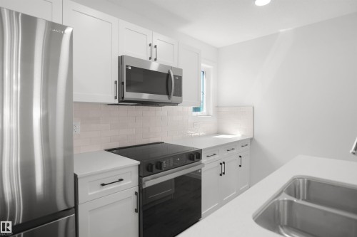 7060 Rosenthal Drive Nw, Edmonton, AB - Indoor Photo Showing Kitchen With Double Sink With Upgraded Kitchen