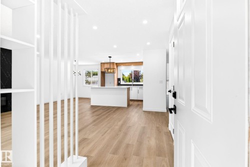 Light wood-finish flooring extending through the space - 5 Peace River Drive, Devon, AB - Indoor