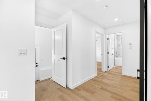 Light wood-finish flooring - 5 Peace River Drive, Devon, AB - Indoor Photo Showing Other Room