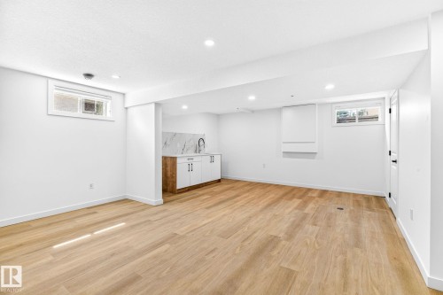 Recessed lighting illuminates the wood-finish flooring - 5 Peace River Drive, Devon, AB - Indoor