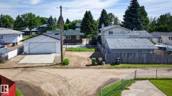 Detached garage with concrete driveway - 