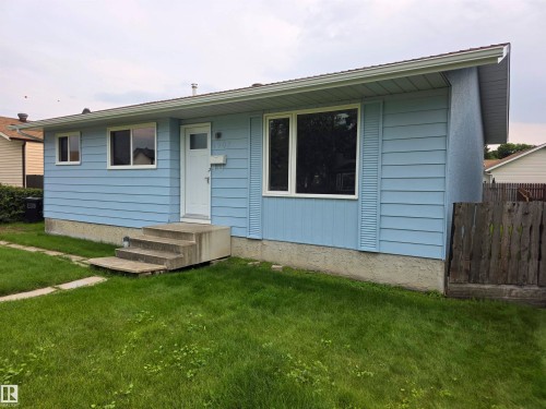 Light blue siding exterior with white window frames and a white front door - 1907 145A Avenue Nw, Edmonton, AB - Outdoor With Exterior