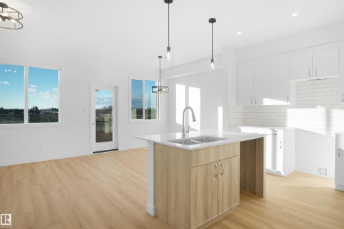 581 Ashgrove Circle, Leduc, AB - Indoor Photo Showing Kitchen With Double Sink