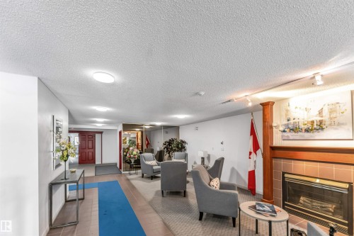 #107 9760 176 St Nw, Edmonton, AB - Indoor With Fireplace