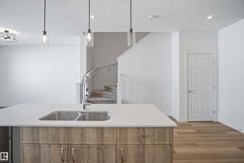 583 Ashgrove Circle, Leduc, AB - Indoor Photo Showing Kitchen With Double Sink