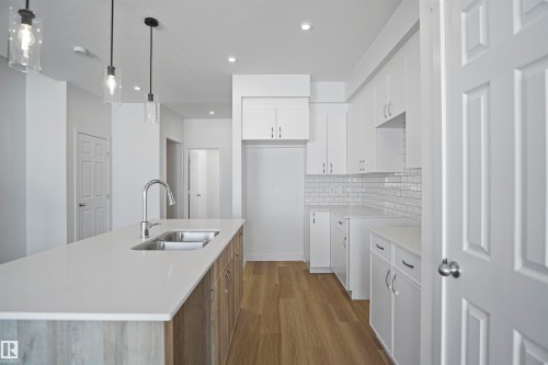 583 Ashgrove Circle, Leduc, AB - Indoor Photo Showing Kitchen With Double Sink With Upgraded Kitchen