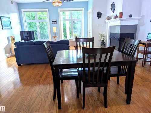 #302 9811 96A St Nw, Edmonton, AB - Indoor Photo Showing Dining Room With Fireplace