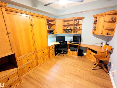 office set up with a "Murphy Bed" for guests - #302 9811 96A St Nw, Edmonton, AB - Indoor Photo Showing Office