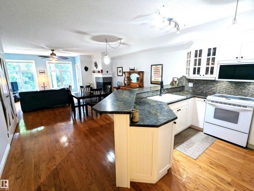 Open Concept to the kitchen making entertaining easy! - #302 9811 96A St Nw, Edmonton, AB - Indoor Photo Showing Kitchen
