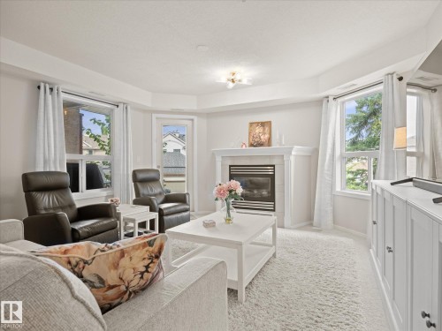 #223 9008 99 Av Nw, Edmonton, AB - Indoor Photo Showing Living Room With Fireplace
