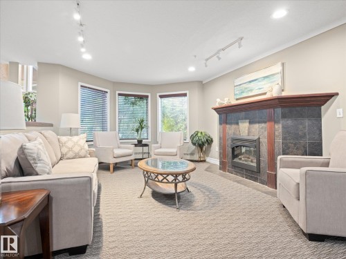 #223 9008 99 Av Nw, Edmonton, AB - Indoor Photo Showing Living Room With Fireplace