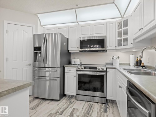 #223 9008 99 Av Nw, Edmonton, AB - Indoor Photo Showing Kitchen With Double Sink