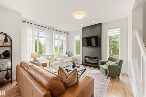 3837 Robins Crescent Nw, Edmonton, AB - Indoor Photo Showing Living Room With Fireplace