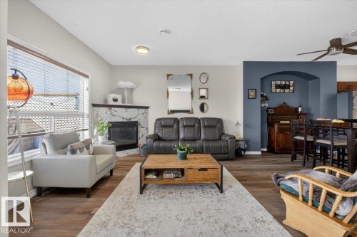 #76 3010 33 Av Nw, Edmonton, AB - Indoor Photo Showing Living Room With Fireplace