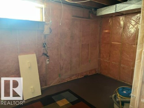 Basement space with visible insulation and exposed framing - 5213 50 Avenue, Vegreville, AB - Indoor Photo Showing Other Room