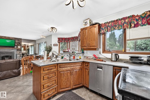 6 Atkinson Place, St. Albert, AB - Indoor Photo Showing Kitchen With Fireplace With Double Sink