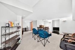 Spacious unfinished basement with soaring ceilings, abundant natural light from recessed fixtures, and flexible open layout - 