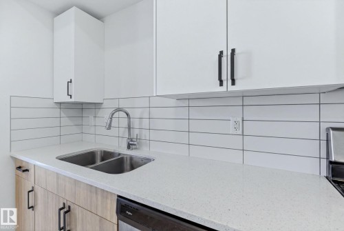 #301 864 Secord Bv Nw, Edmonton, AB - Indoor Photo Showing Kitchen With Double Sink