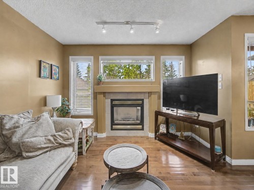 1754 Turvey Bend Bend Nw, Edmonton, AB - Indoor Photo Showing Living Room With Fireplace