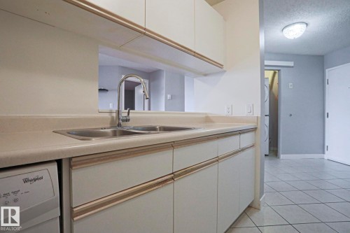 #208 6710 158 Av Nw, Edmonton, AB - Indoor Photo Showing Kitchen With Double Sink