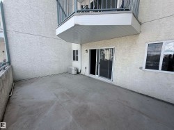 Concrete patio with textured stucco exterior - 