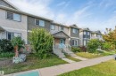 Three-story property with light-colored siding and a contrasting darker accent panel - 3106 15 Avenue Nw, Edmonton, AB  - Outdoor With Facade 