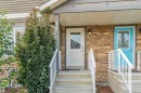 Stone-finish exterior with white trim and a covered entrance - 3106 15 Avenue Nw, Edmonton, AB  - Outdoor With Exterior 