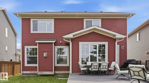 Modern two-story residence featuring a brick and fiber cement siding exterior with a peaked roofline and cream-colored trim - 63 Rosemount Boulevard, Beaumont, AB - Outdoor With Exterior