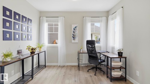 Recessed lighting illuminates wood-finish flooring - 63 Rosemount Boulevard, Beaumont, AB - Indoor Photo Showing Office