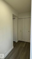 Wood-finish flooring with crisp white baseboards - 