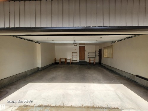 Attached garage space with concrete flooring, recessed lighting, and a utility window - 4140 147 Street Nw, Edmonton, AB - Indoor Photo Showing Garage