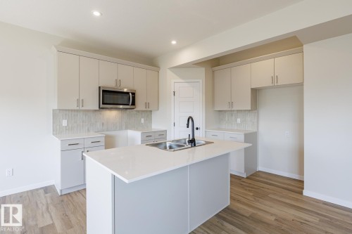 99 Silverstone Drive, Stony Plain, AB - Indoor Photo Showing Kitchen With Double Sink