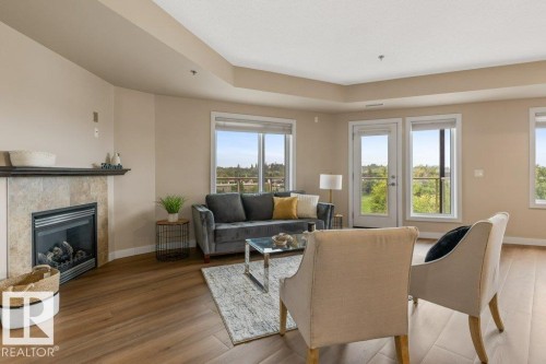 #205 35 Sturgeon Rd, St. Albert, AB - Indoor Photo Showing Living Room With Fireplace