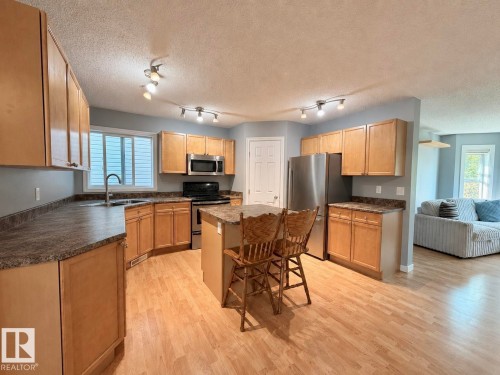 105 Keystone Crescent, Leduc, AB - Indoor Photo Showing Kitchen With Double Sink
