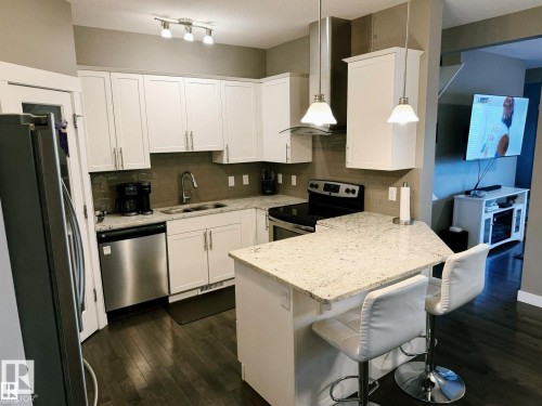 7028 174 Avenue Nw, Edmonton, AB - Indoor Photo Showing Kitchen With Stainless Steel Kitchen With Double Sink