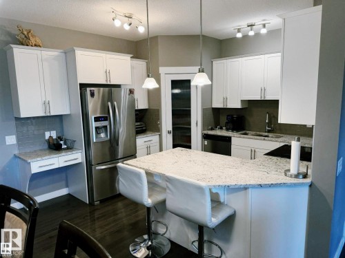 7028 174 Avenue Nw, Edmonton, AB - Indoor Photo Showing Kitchen With Stainless Steel Kitchen