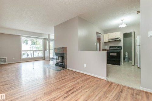 #23 14620 26 St Nw, Edmonton, AB - Indoor With Fireplace