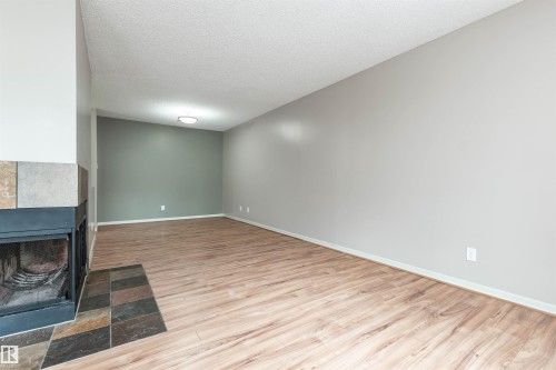 #23 14620 26 St Nw, Edmonton, AB - Indoor Photo Showing Other Room With Fireplace