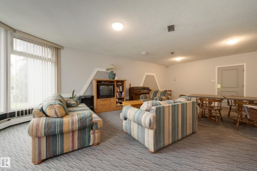 #213 5125 Riverbend Rd Nw, Edmonton, AB - Indoor Photo Showing Living Room