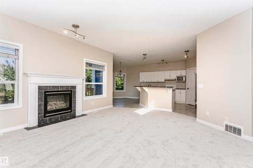21 Alderson Close, Fort Saskatchewan, AB - Indoor Photo Showing Living Room With Fireplace