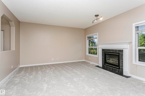 21 Alderson Close, Fort Saskatchewan, AB - Indoor Photo Showing Living Room With Fireplace